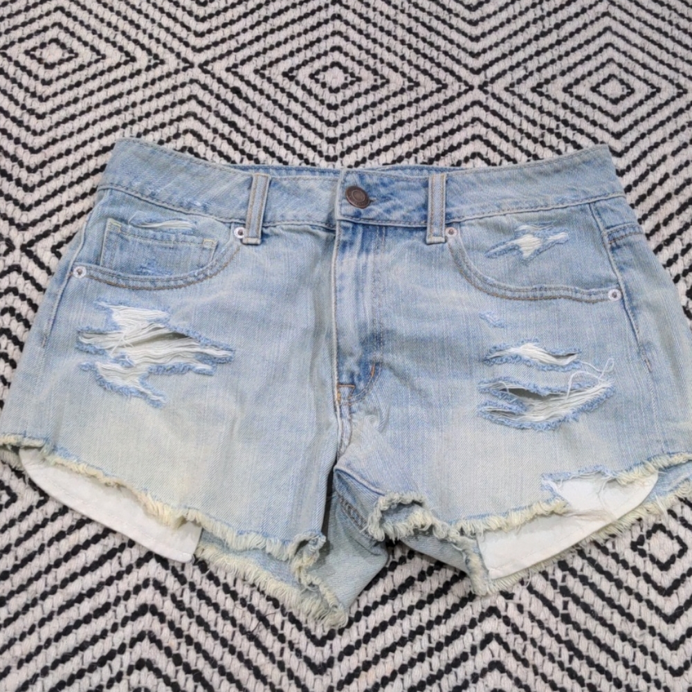 Distressed light jean shorts